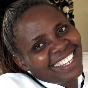 African afro woman laughing close up face